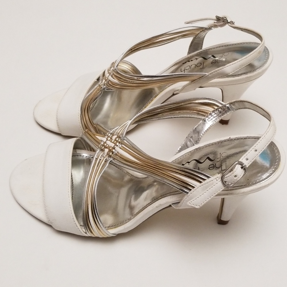 White heels with gold and silver accents